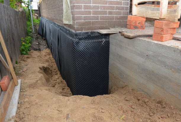 Happy homeowners after waterproofing job in Fultonham